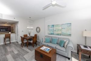 a living room with a couch and a table at Luau 6907 Sandestin Florida Beach Rentals 1 BR Tram included in Destin