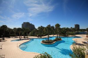 a large pool with blue water in a resort at Luau 6907 Sandestin Florida Beach Rentals 1 BR Tram included in Destin