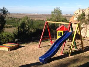 a playground with a slide at Holiday home Monte Pego in Monte Pego
