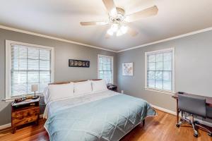 a bedroom with a bed and a ceiling fan at Sycamore Place Duplex in Atlanta