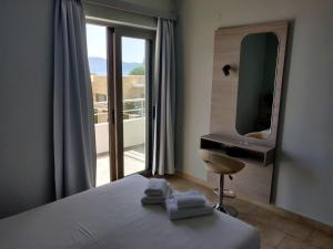 Ένα ή περισσότερα κρεβάτια σε δωμάτιο στο Viglia Beach Apartments 