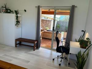 an office with a desk and a chair in a room at Serenity in Style in Kalbarri