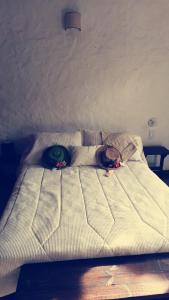 En eller flere senge i et værelse på Hospedaje Iraca - Pueblito Boyacense