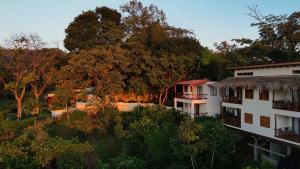 an aerial view of a building and trees at Tierra Magnifica Boutique Hotel in Nosara