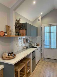 a kitchen with a counter with a bowl on it at Stylish Geelong Cabin - Your home away from home in Belmont