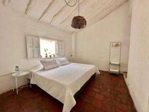 Ένα ή περισσότερα κρεβάτια σε δωμάτιο στο Casa Sua