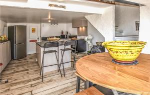 a kitchen with a table and a bowl on top of it at Amazing Home In Sault With Outdoor Swimming Pool in Sault-de-Vaucluse
