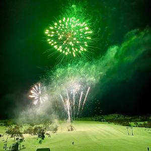 a firework display in a field at night at Lodge 21 in Perisher Valley