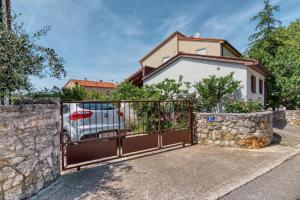 a gate in front of a house at House Tiny house in Banjole