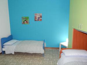 Ένα ή περισσότερα κρεβάτια σε δωμάτιο στο Casa Vacanze Karol