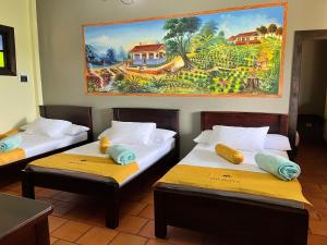 Un pat sau paturi într-o cameră la Hotel Campestre Los Mangos