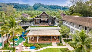 an aerial view of a resort with a pool at Outrigger Khao Lak Beach Resort - SHA Extra Plus in Khao Lak