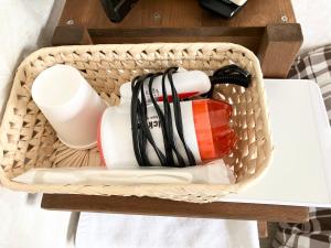 a basket with cups and other items on a table at Babaji's Kriya Yoga Restoration Center - Vacation STAY 27036v in Hokuto