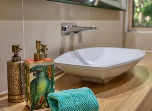 a bathroom with a sink and a bath tub at Narrows Escape Rainforest Retreat in Montville