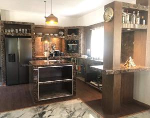 a kitchen with a counter and a counter top at 4 bedroom villa aline in Marga