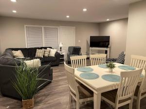 a living room with a table and a couch at Spacious Home near Airport in Bangor