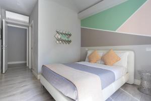 A bed or beds in a room at Scipioni Best Rooms