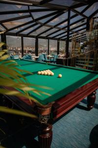 a pool table with balls on top of it at Hotel Old Town in Batumi