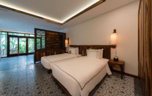Giường trong phòng chung tại Alibu Resort Nha Trang