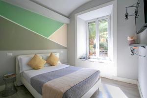 A bed or beds in a room at Scipioni Best Rooms