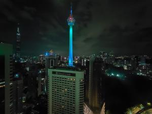 a view of the oriental pearl tower lit up at night at Vortex Suites in Kuala Lumpur