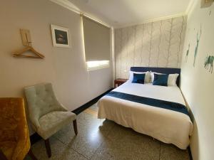 Postel nebo postele na pokoji v ubytování Kenting Heng-Chung Art Hostel