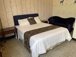 Postel nebo postele na pokoji v ubytování Kenting Heng-Chung Art Hostel