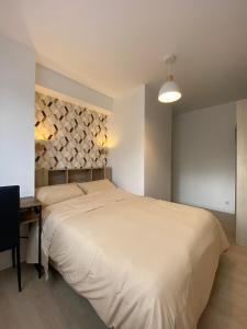 Posteľ alebo postele v izbe v ubytovaní Sleep In La Mulatière