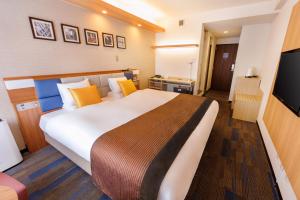 Letto o letti in una camera di Floral Hotel East Shinsaibashi
