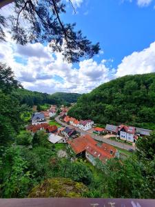 a small town in the middle of a mountain at Pension Schul Inn in Ruhla