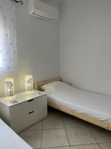 Postel nebo postele na pokoji v ubytování Dina Apartment