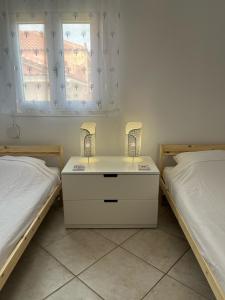 Postel nebo postele na pokoji v ubytování Dina Apartment