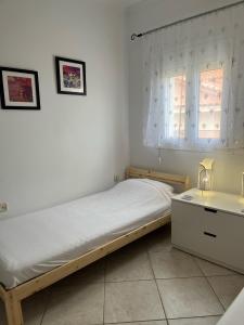 Postel nebo postele na pokoji v ubytování Dina Apartment