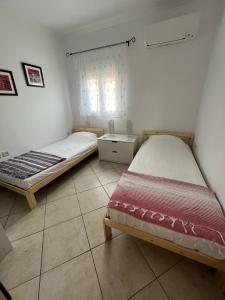 Postel nebo postele na pokoji v ubytování Dina Apartment