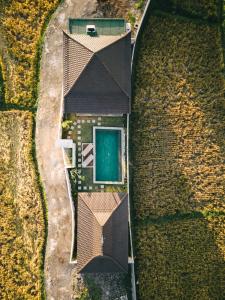 an overhead view of a house in a field at DABA - Designer Villas in Perenenan - Beach 600M in Canggu