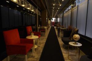 a corridor of a restaurant with chairs and tables at Florya House Hotel in Istanbul