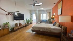 a large bedroom with a bed and a ceiling fan at Notre Maison 5 Saigon close Walking street in Thao Dien D2 in Ho Chi Minh City