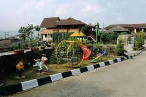 a playground with a slide at Hotel Pesona Ciwidey in Ciwidey