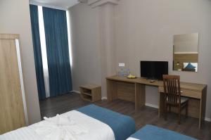 Postel nebo postele na pokoji v ubytování Harmony Hotel