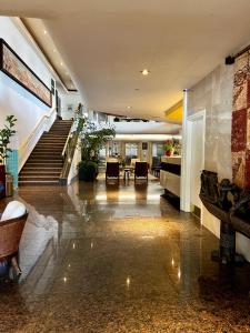 a lobby of a building with a staircase and a room at Luana Waikiki Park Views in Honolulu