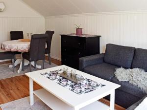a living room with a couch and a table at Apartment Frederikstad in Fredrikstad