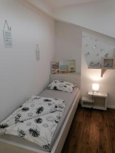 Posteľ alebo postele v izbe v ubytovaní Apartmani Kiko