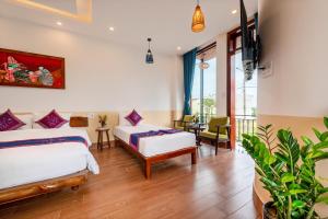 Ένα ή περισσότερα κρεβάτια σε δωμάτιο στο An Bang Chic Villa Nguyên Căn