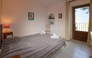 a bedroom with a bed with towels on it at 1 Bedroom Nice Apartment In Carcheto Brustico in Carcheto