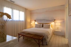 a bedroom with a large bed and a window at Villas les Capucines in Sète +91 photos