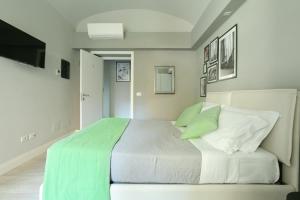 A bed or beds in a room at Scipioni Best Rooms