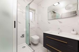 a bathroom with a sink toilet and a mirror at Apartment in Silo/Insel Krk 13445 in Šilo