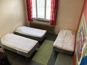 Postel nebo postele na pokoji v ubytování Kotapiha