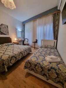 Postel nebo postele na pokoji v ubytování Albergo Casa Peron