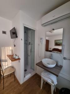 Postel nebo postele na pokoji v ubytování Albergo Casa Peron